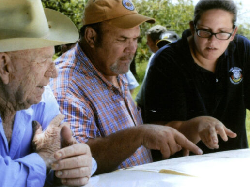 Tribal Archaeologist Maureen Mahoney (far right) speaks with the late Neal Brown (far left), grandson of Bill Brown who built an early 20th century trading post on what is now the Big Cypress Reservation — Tribal Archaeology — Seminole Tribal Historic Preservation Office Tribal Archaeologist Maureen Mahoney (far right) speaks with the late Neal Brown (far left), grandson of Bill Brown who built an early 20th century trading post on what is now the Big Cypress Reservation — Tribal Archaeology — Seminole Tribal Historic Preservation Office